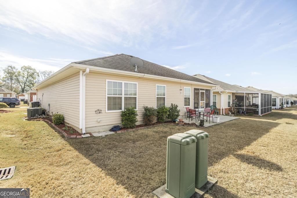 216 South Houston Springs Boulevard Perry, GA 31069 - Photo 27 of 31 a view of a house with backyard and sitting area