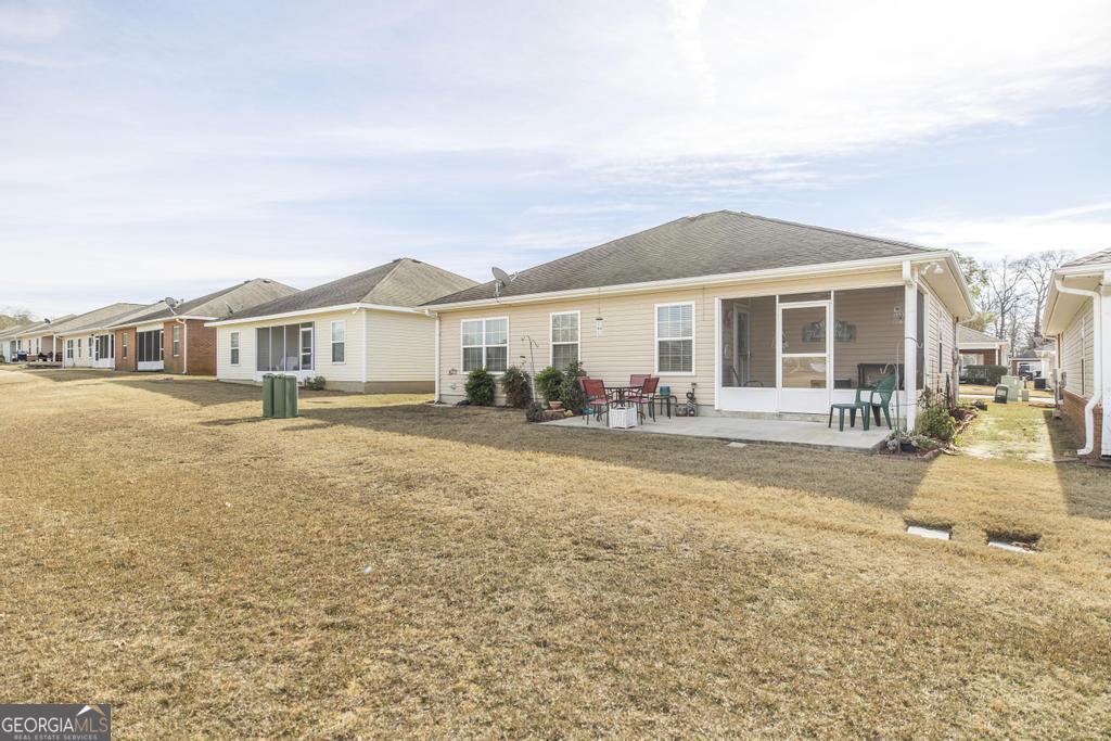 216 South Houston Springs Boulevard Perry, GA 31069 - Photo 29 of 31 a front view of a house with a yard