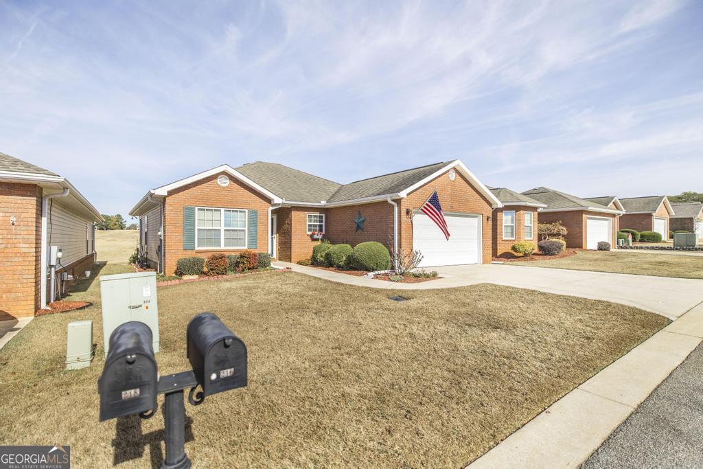 216 South Houston Springs Boulevard Perry, GA 31069 - Photo 4 of 31 a view of a house with swimming pool and sitting area