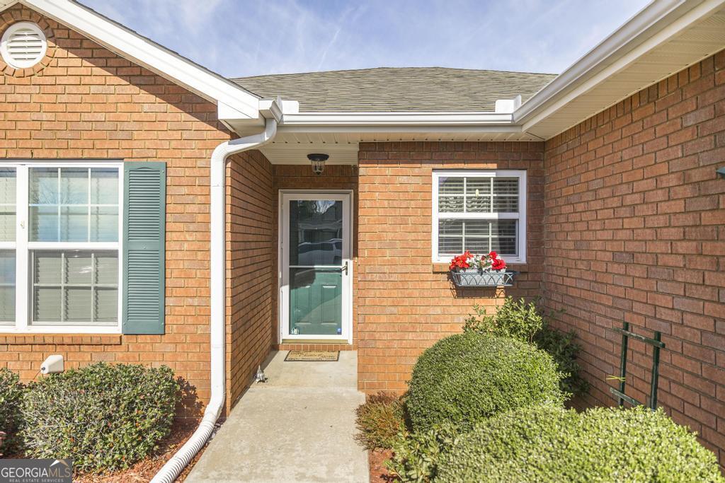 216 South Houston Springs Boulevard Perry, GA 31069 - Photo 6 of 31 a view of a backyard with a garden