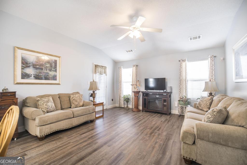 216 South Houston Springs Boulevard Perry, GA 31069 - Photo 9 of 31 a living room with furniture and a flat screen tv