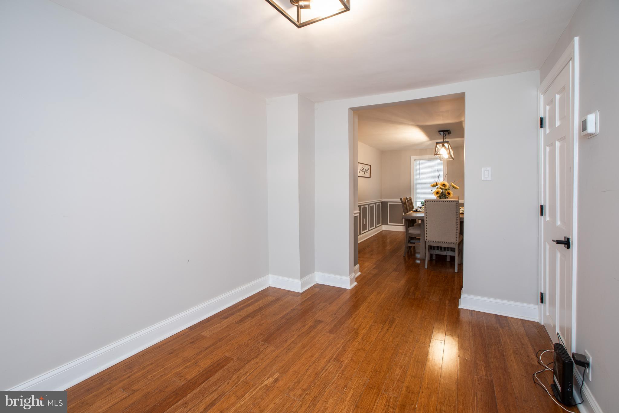 239 Main Street Hamilton, NJ 08620 - Photo 13 of 39 a view of a room with wooden floor and furniture