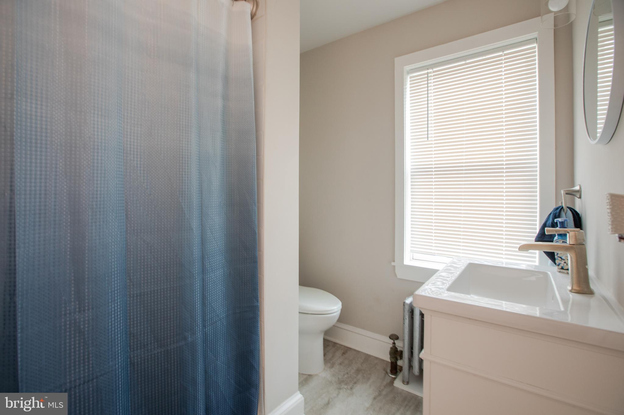 239 Main Street Hamilton, NJ 08620 - Photo 15 of 39 a bathroom with a sink and a toilet