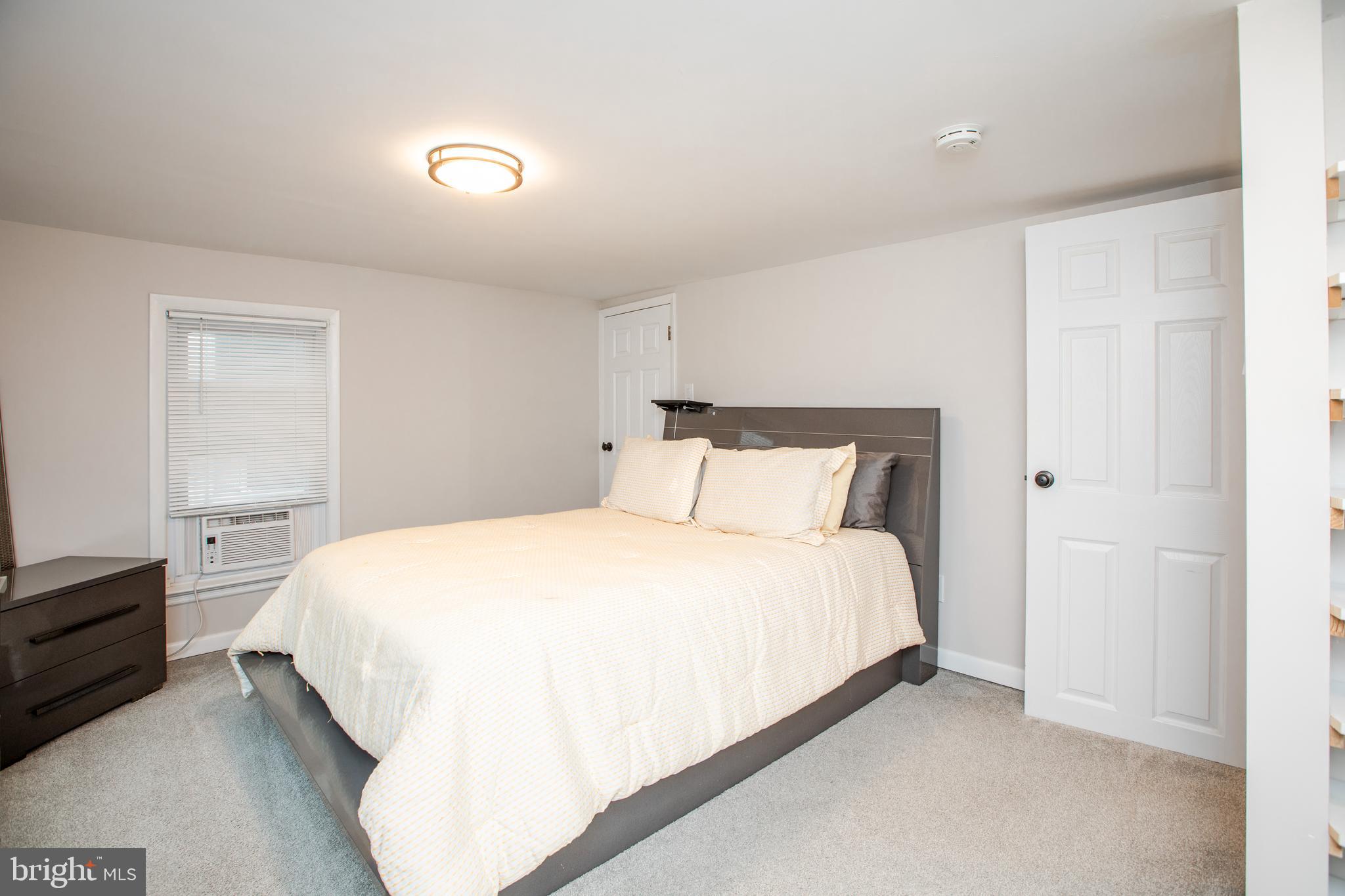 239 Main Street Hamilton, NJ 08620 - Photo 18 of 39 a bedroom with a bed and dresser