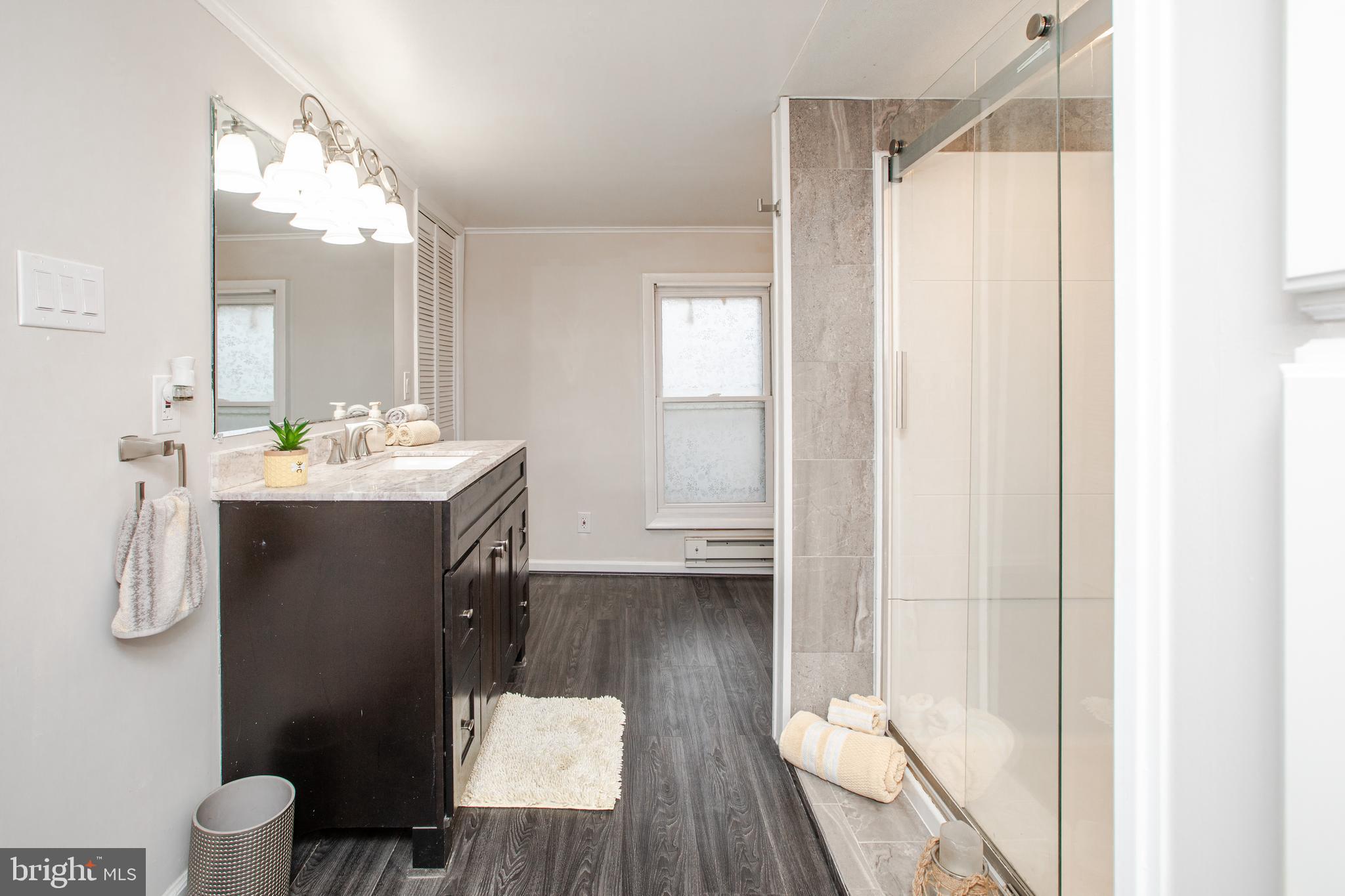 239 Main Street Hamilton, NJ 08620 - Photo 20 of 39 a bathroom with a sink toilet and shower