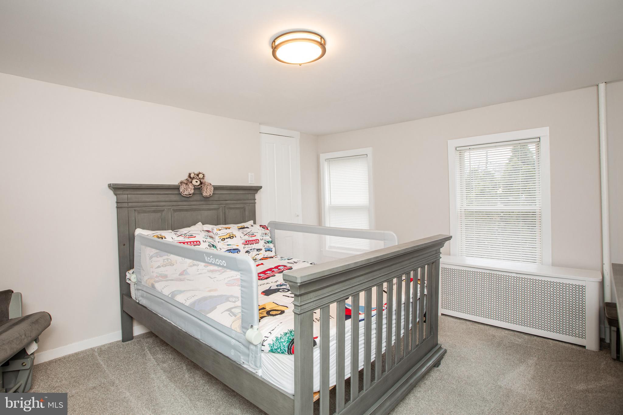 239 Main Street Hamilton, NJ 08620 - Photo 23 of 39 a bedroom with a bed and a window