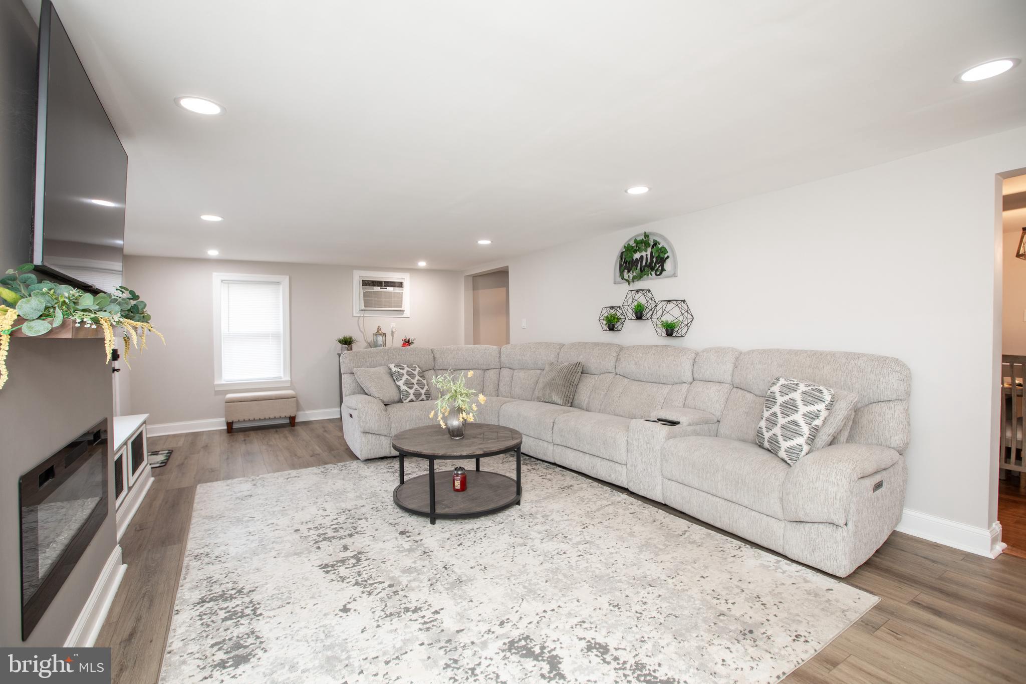239 Main Street Hamilton, NJ 08620 - Photo 4 of 39 a living room with furniture and a flat screen tv
