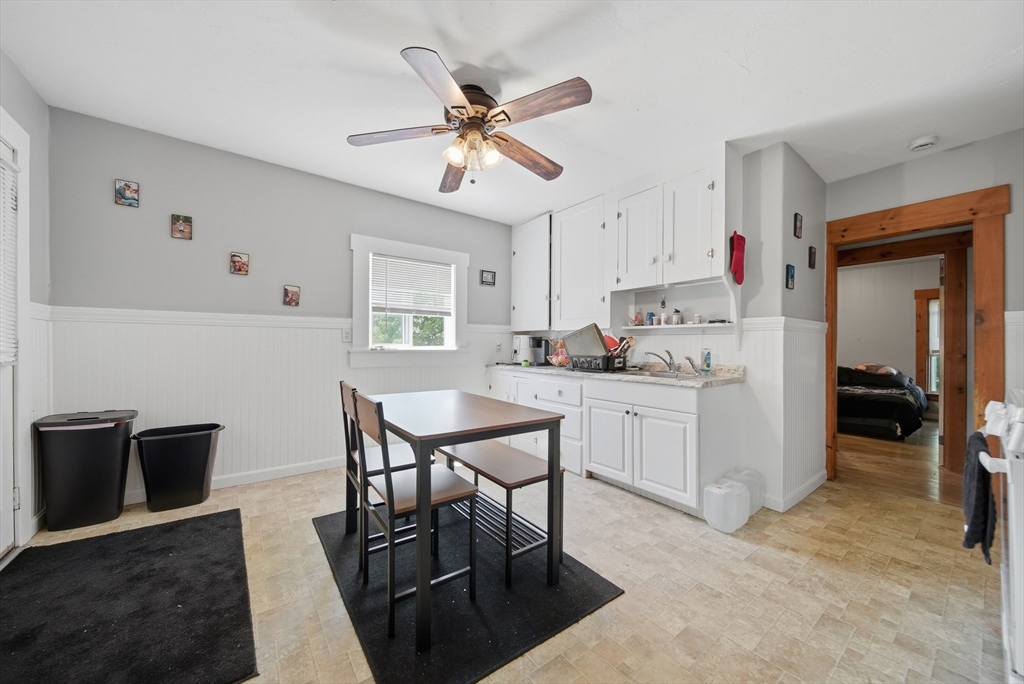 436 Franklin Road Fitchburg, MA 01420 - Photo 23 of 41 a kitchen with kitchen island a dining table and chairs
