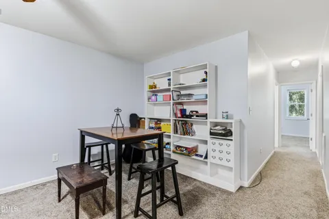 a view of a workspace with furniture