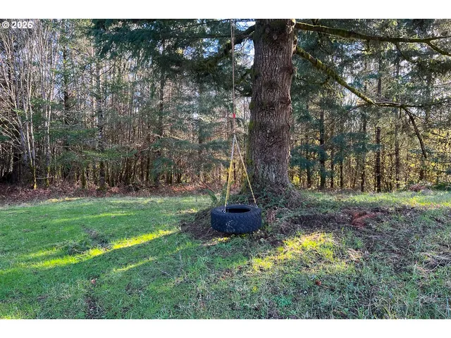 a backyard of a house with lots of green space