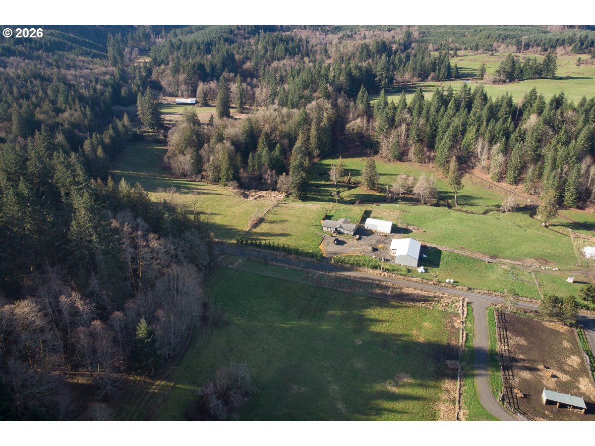 0 Bishop Creek Road Deer Island, OR 97054 - Photo 21 of 26 a view of a town with mountains in the background
