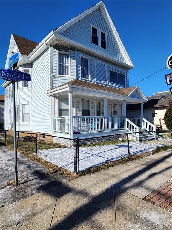 147 Newfield Avenue Bridgeport, CT 06607 - Photo 1 of 1 a front view of a house with porch