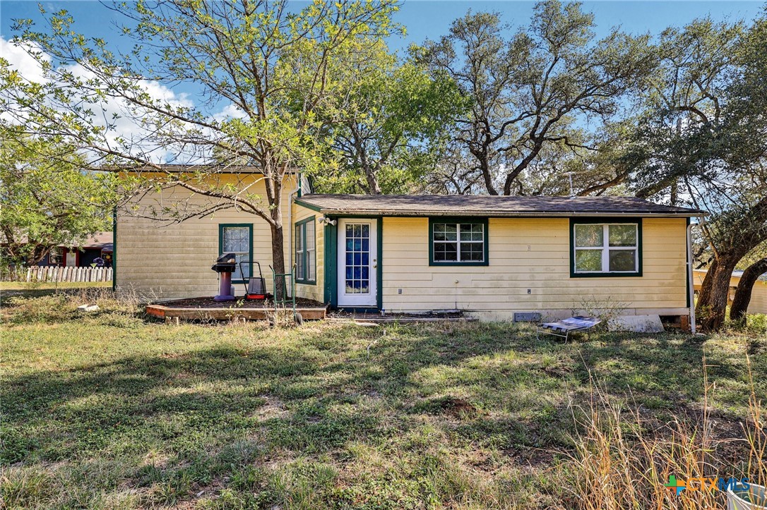 24007 Windy Valley Road Leander, TX 78641 - Photo 20 of 24 a view of a backyard with plants and large tree