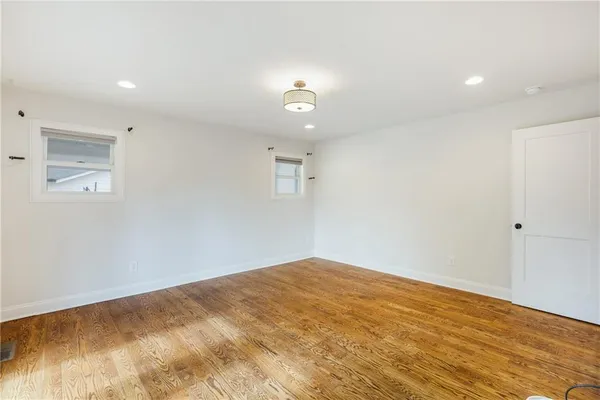 a bathroom with a double vanity sink mirror double and shower