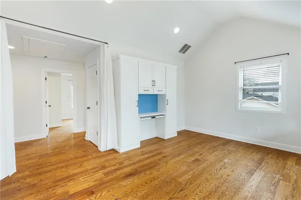 a view of a porch with wooden floor