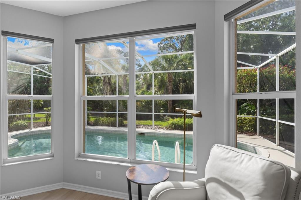 1717 Winding Oaks Way Naples, FL 34109 - Photo 15 of 29 a room with furniture and windows