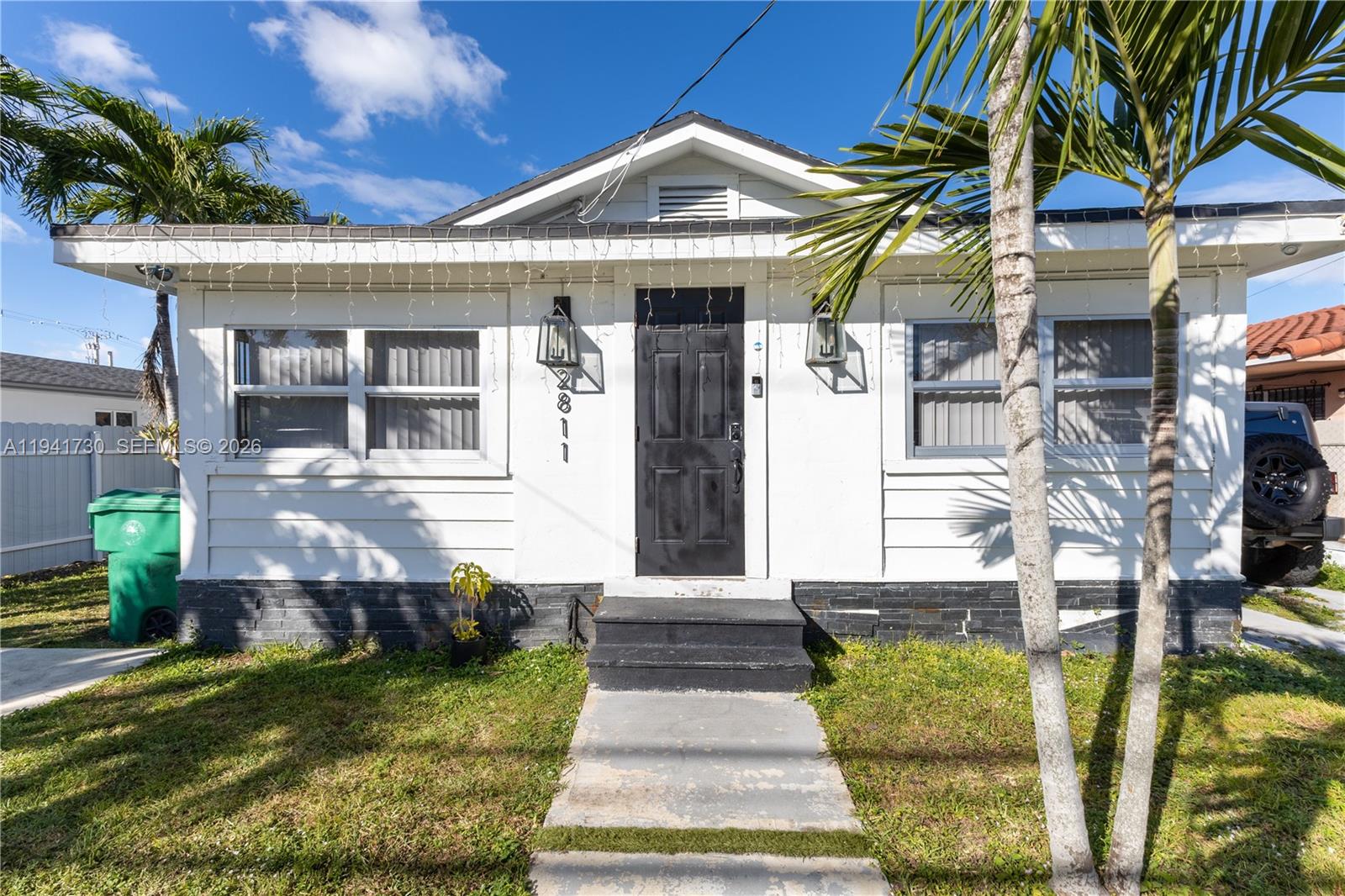 2811 Southwest 17th Street Miami, FL 33145 - Photo 3 of 36 a front view of a house with garden