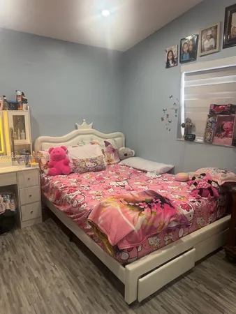 a bedroom with a bed and closet