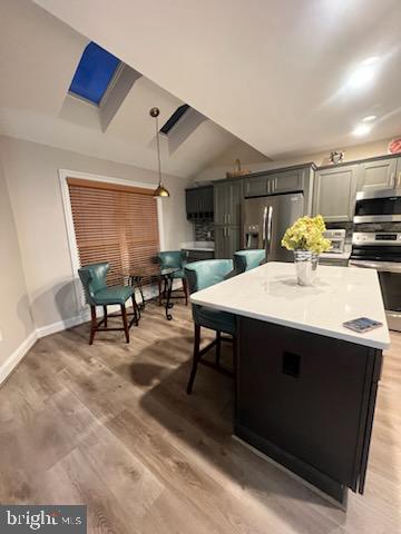 3300 Spriggs Request Way Bowie, MD 20721 - Photo 16 of 17 a kitchen with stainless steel appliances a sink a table and chairs