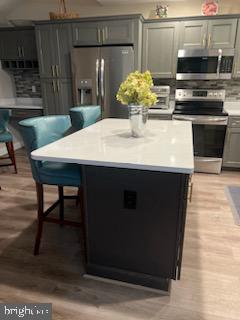 3300 Spriggs Request Way Bowie, MD 20721 - Photo 17 of 17 a kitchen with a table chairs and a stove