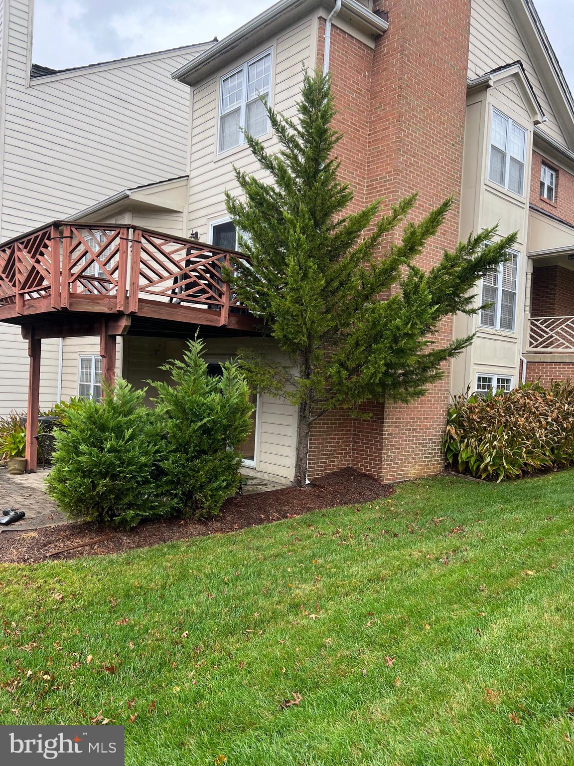 3300 Spriggs Request Way Bowie, MD 20721 - Photo 4 of 17 a front view of a house with a garden and plants