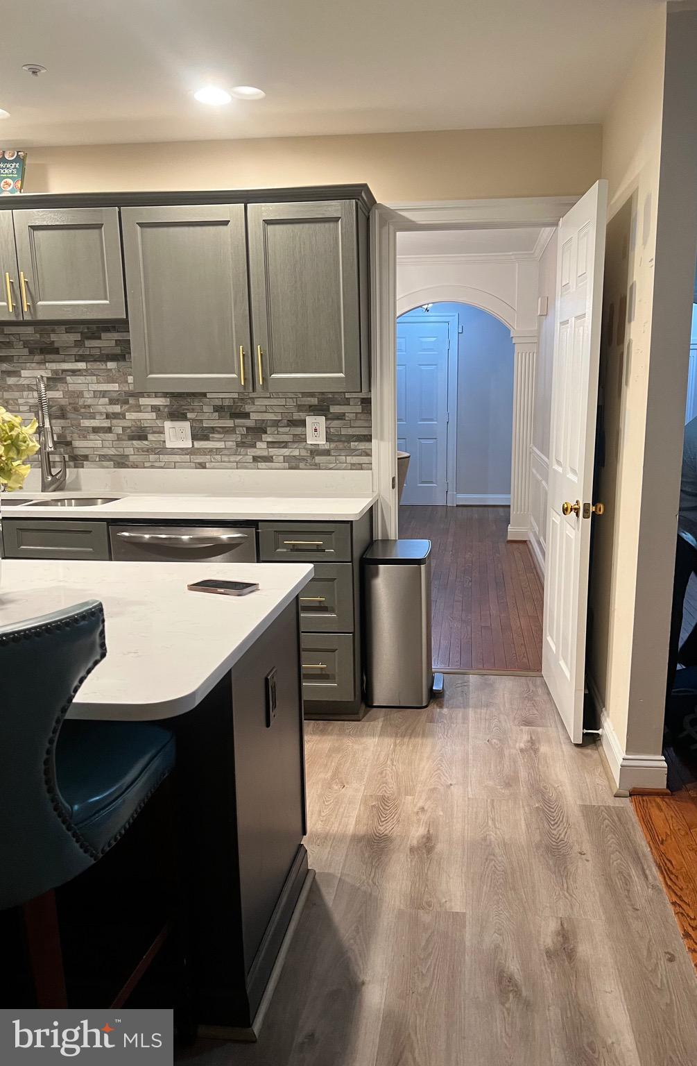 3300 Spriggs Request Way Bowie, MD 20721 - Photo 6 of 17 a kitchen with stainless steel appliances granite countertop a sink stove and refrigerator