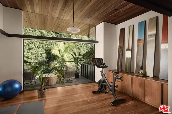 a bedroom with a bed and a fireplace