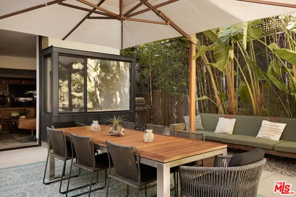 a kitchen with a table and chairs in it
