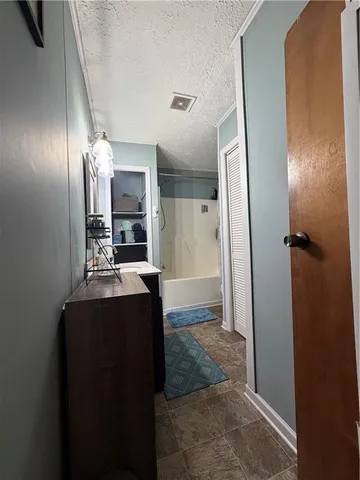 a view of a kitchen from the hallway