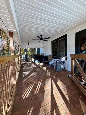 a view of a porch with furniture and a flat screen tv