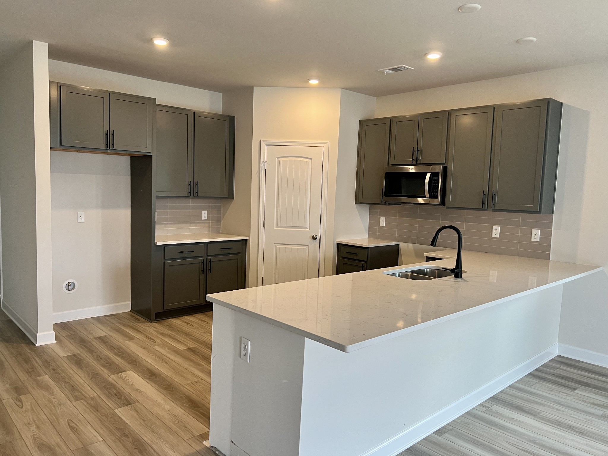 4111 Dwight Way Murfreesboro, TN 37128 - Photo 12 of 28 a kitchen with kitchen island a sink stainless steel appliances and cabinets