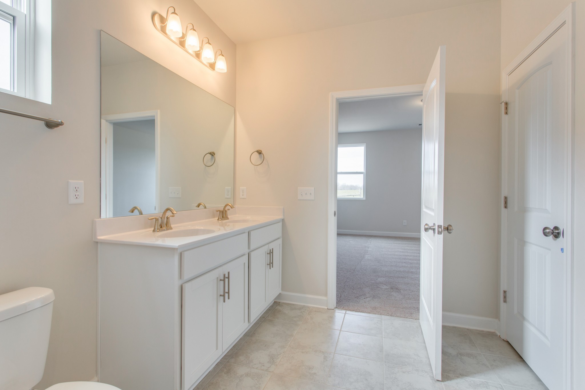 4111 Dwight Way Murfreesboro, TN 37128 - Photo 19 of 28 a bathroom with a double vanity sink and mirror with toilet