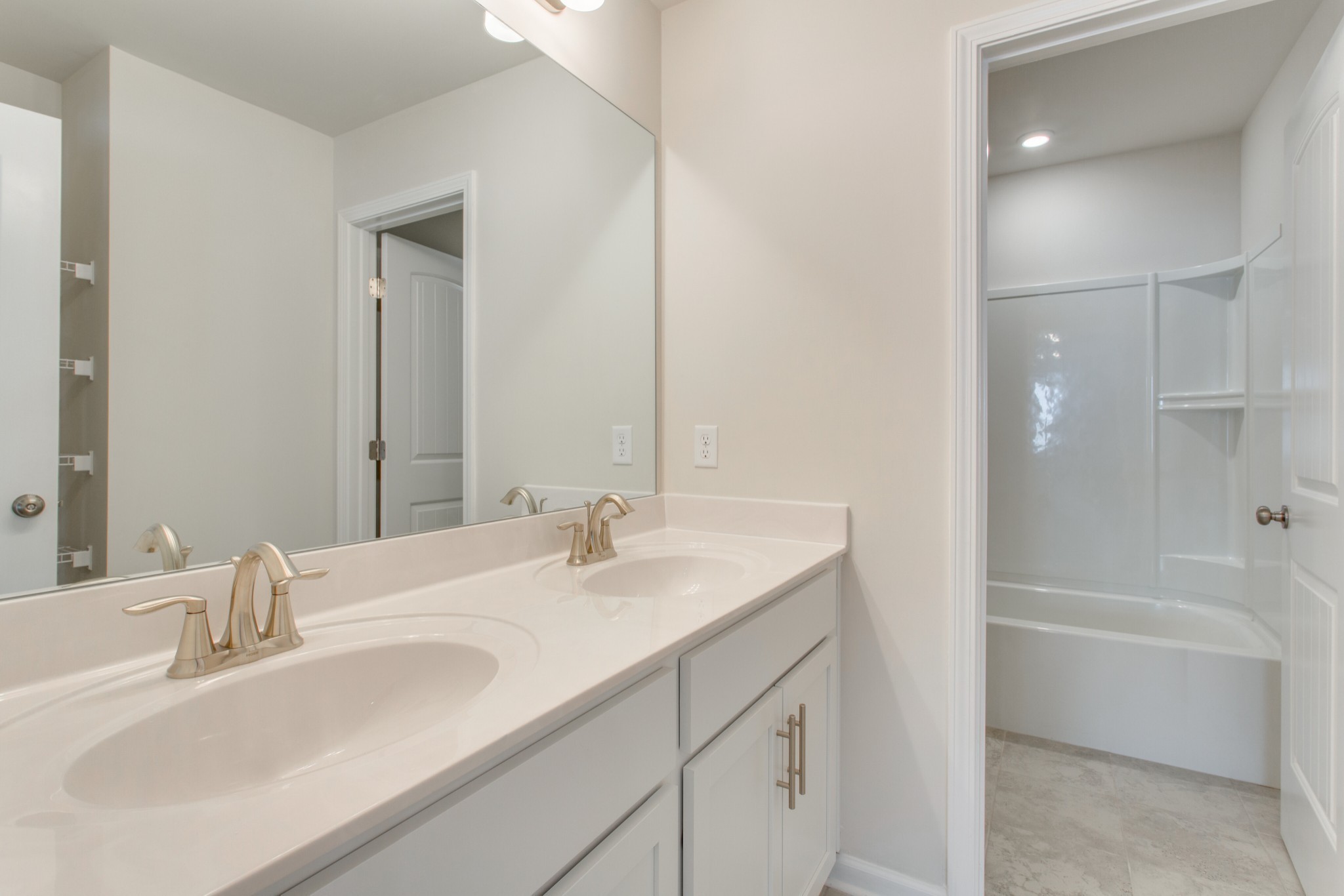 4111 Dwight Way Murfreesboro, TN 37128 - Photo 25 of 28 a bathroom with a sink double vanity granite tub shower and a mirror