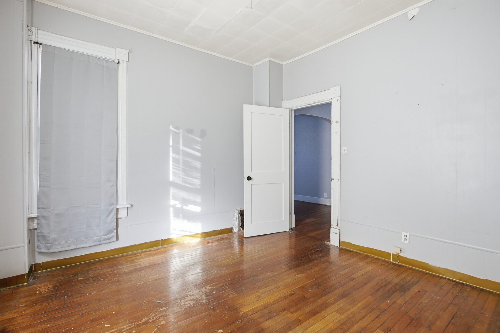 2115 West 4th Street Davenport, IA 52802 - Photo 17 of 24 an empty room with wooden floor