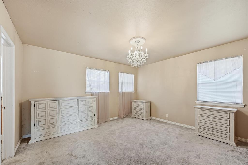 206 West Ridgewood Drive Garland, TX 75041 - Photo 13 of 21 a view of an empty room with a window