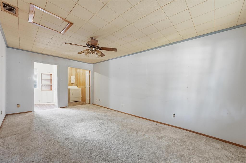 206 West Ridgewood Drive Garland, TX 75041 - Photo 16 of 21 a view of a room with a ceiling fan and window