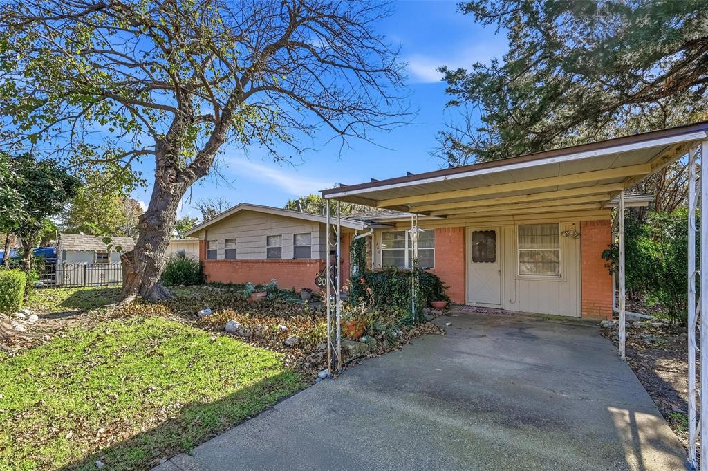 206 West Ridgewood Drive Garland, TX 75041 - Photo 2 of 21 a front view of a house with garden