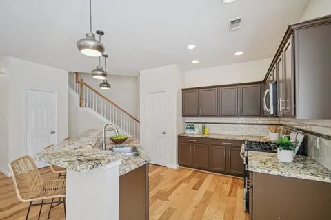 a bathroom with a toilet a sink and a mirror