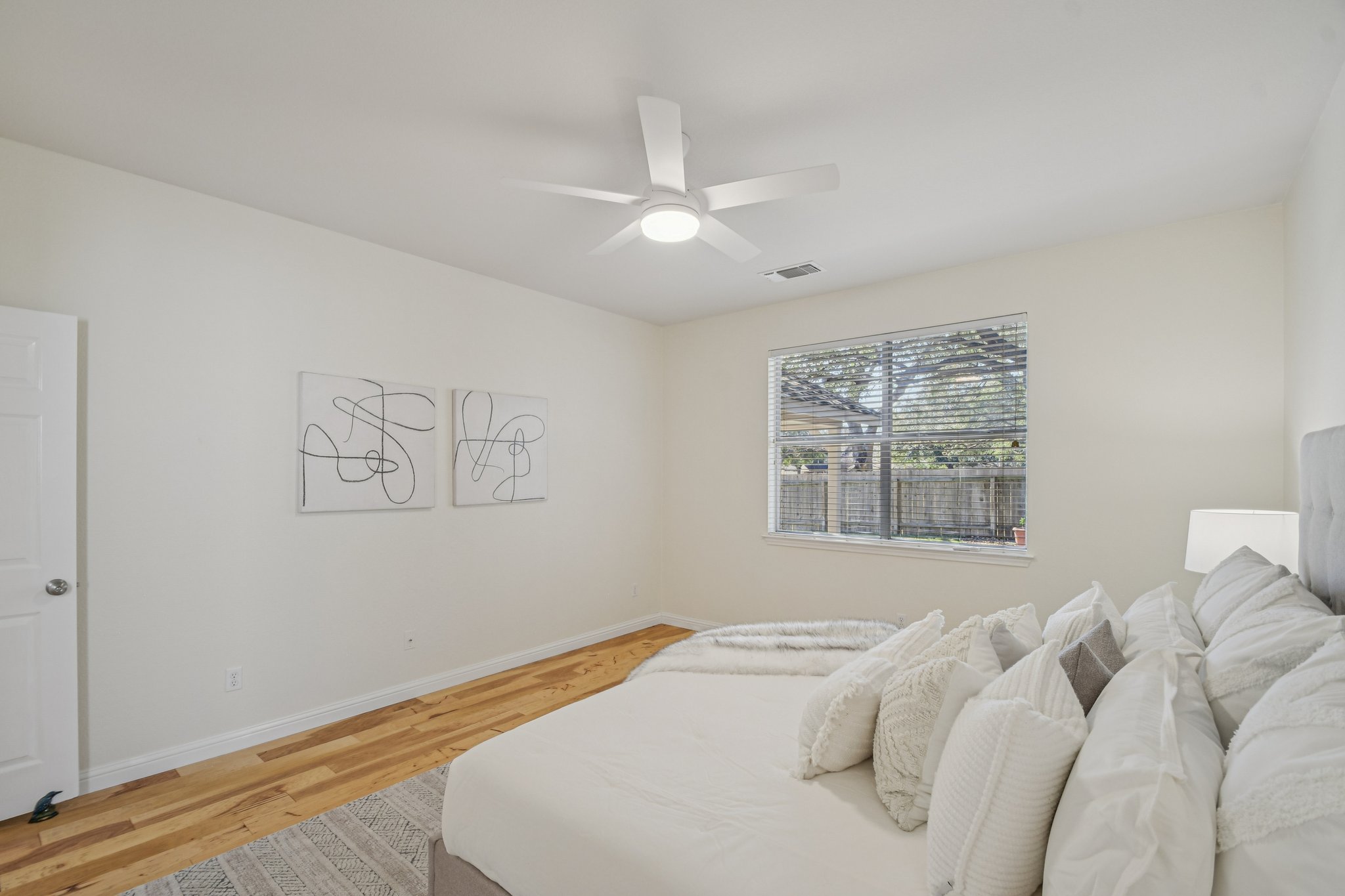 5947 Lomita Verde Circle Austin, TX 78749 - Photo 21 of 40 a bedroom with a bed and a window