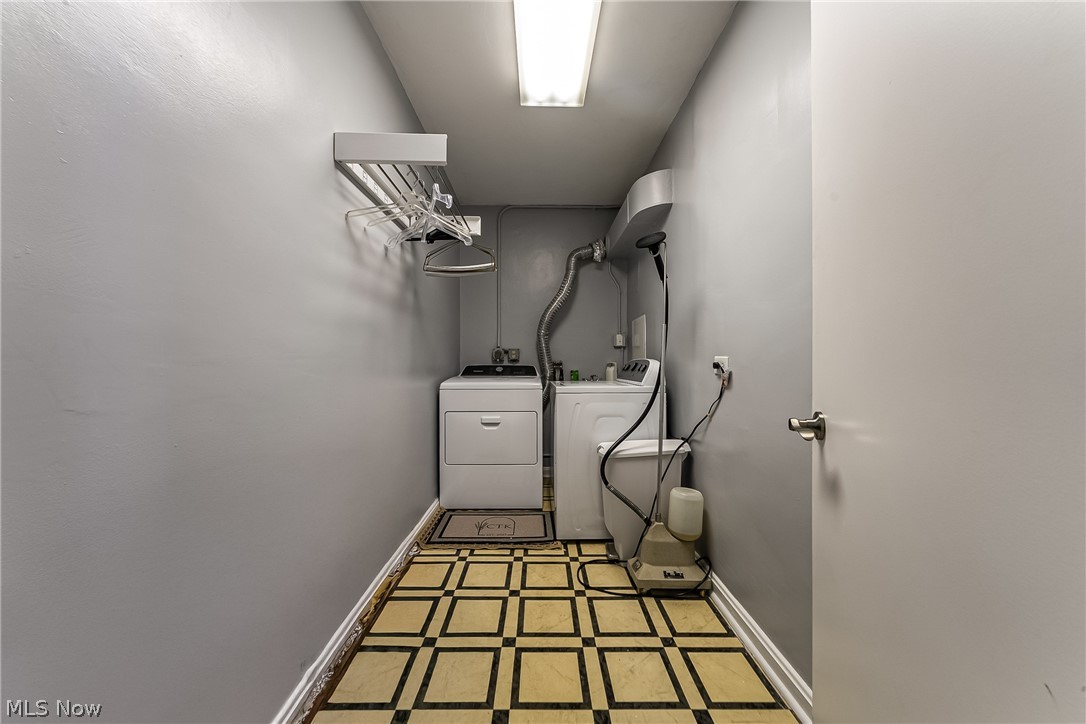 13800 Fairhill Road, Unit 306 Cleveland, OH 44120 - Photo 41 of 48 Laundry room featuring washer and dryer and inlaid floor details
