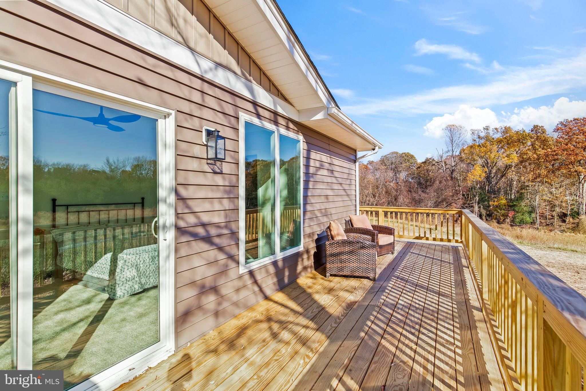 1710 Old Adelina Road Prince Frederick, MD 20678 - Photo 20 of 38 Sunny deck with scenic autumn views.