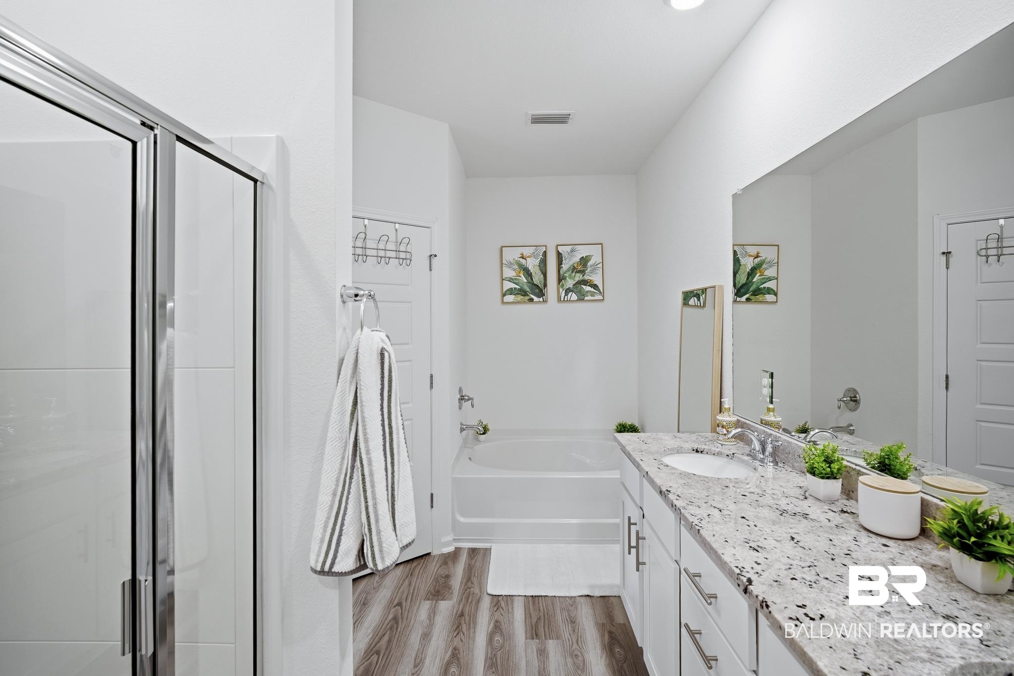 13887 Antler Hl Road Daphne, AL 36527 - Photo 20 of 50 Bathroom with vanity, a stall shower, light wood-style flooring, and a garden tub