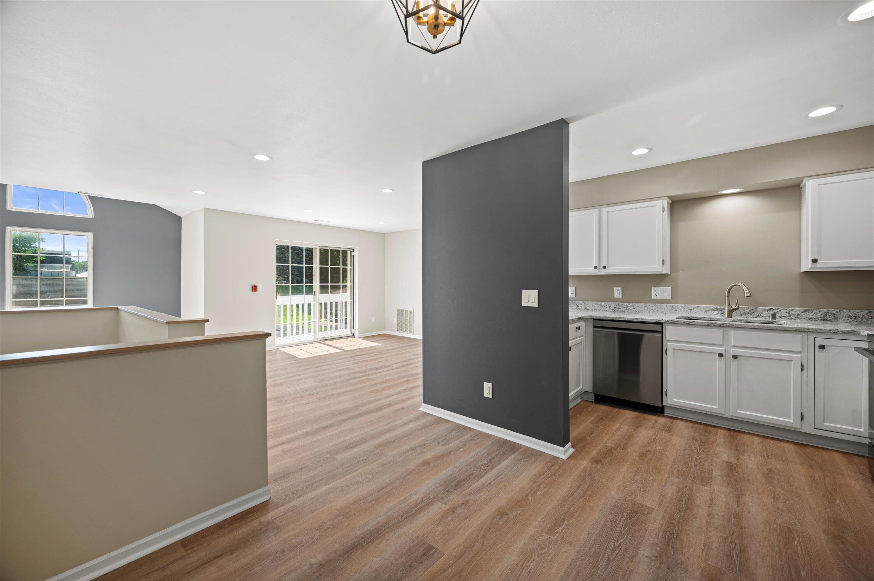 1848 Division Street, Unit 8 East Troy, WI 53120 - Photo 9 of 24 09-Living Room opens to Kitchen