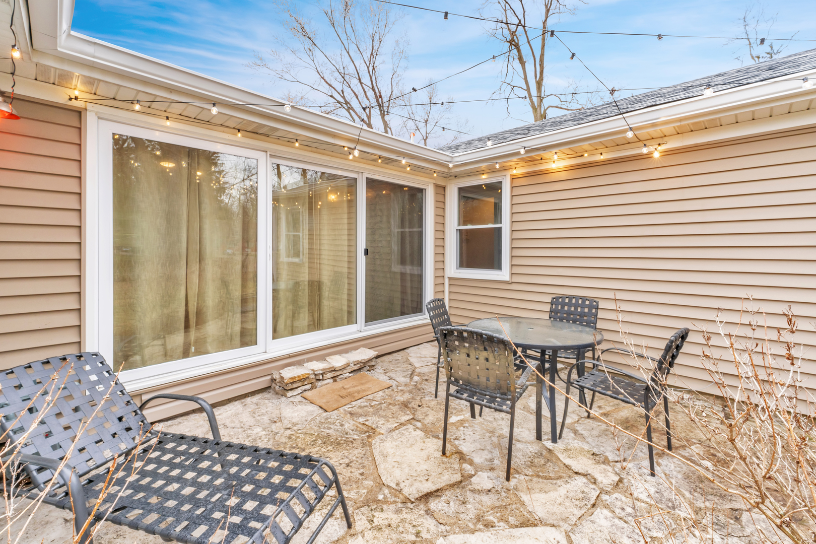 349 Haman Road Inverness, IL 60067 - Photo 17 of 36 a patio with table and chairs and potted plants