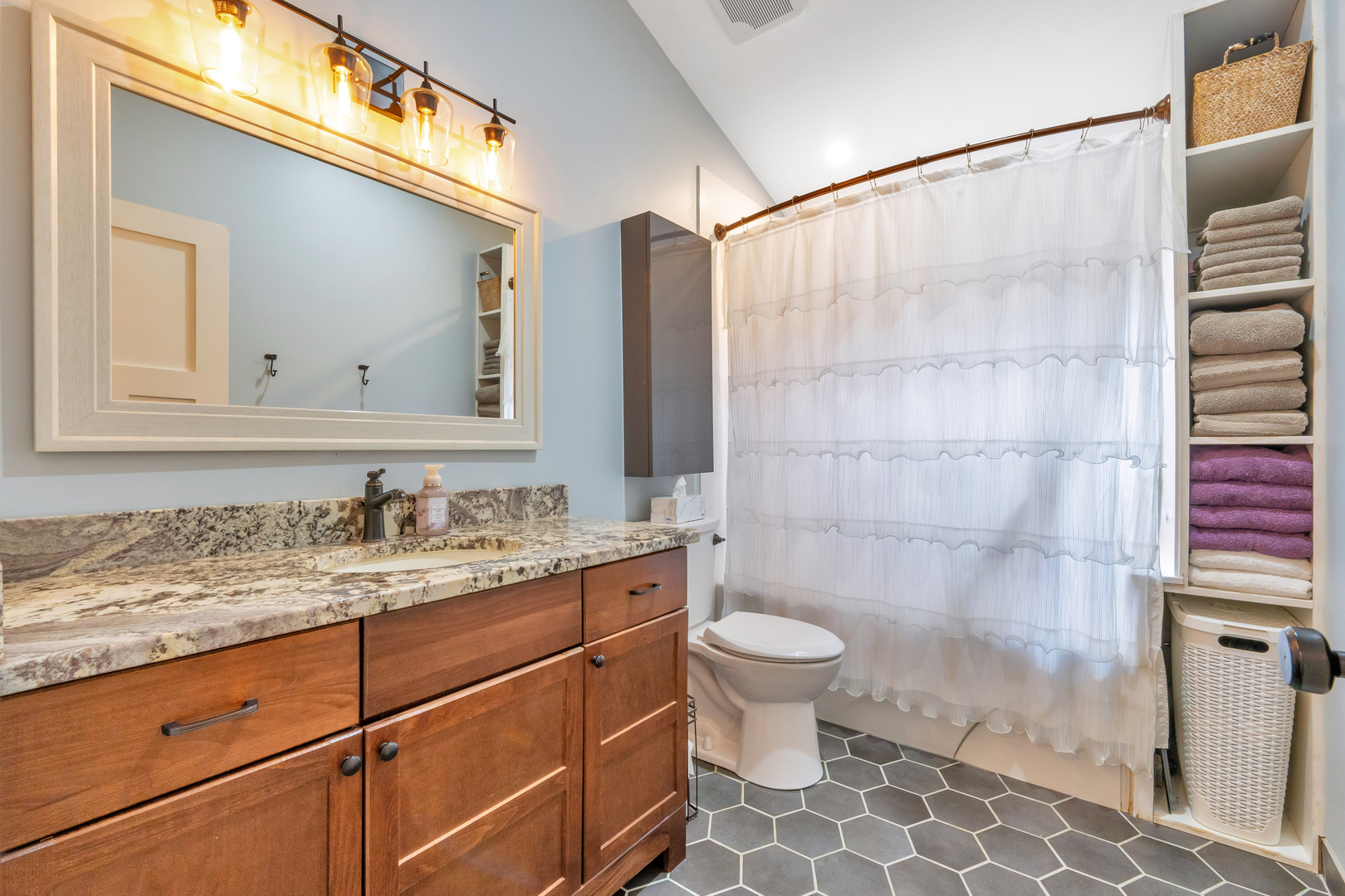 349 Haman Road Inverness, IL 60067 - Photo 26 of 36 a bathroom with a granite countertop sink a toilet and shower