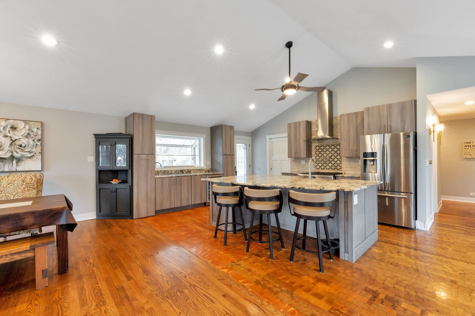 349 Haman Road Inverness, IL 60067 - Photo 10 of 36 a kitchen with stainless steel appliances kitchen island granite countertop a table chairs and a refrigerator
