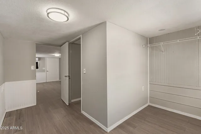 a view of hallway with wooden floor