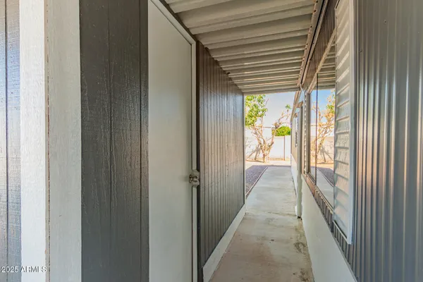 a view of a hallway with a outdoor space