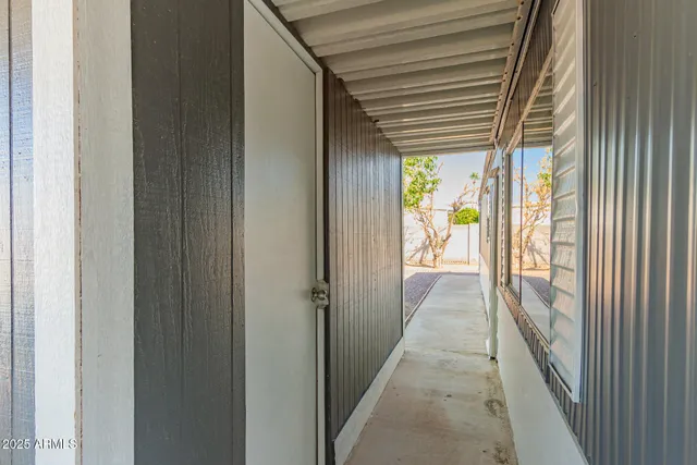 a view of a hallway with a outdoor space