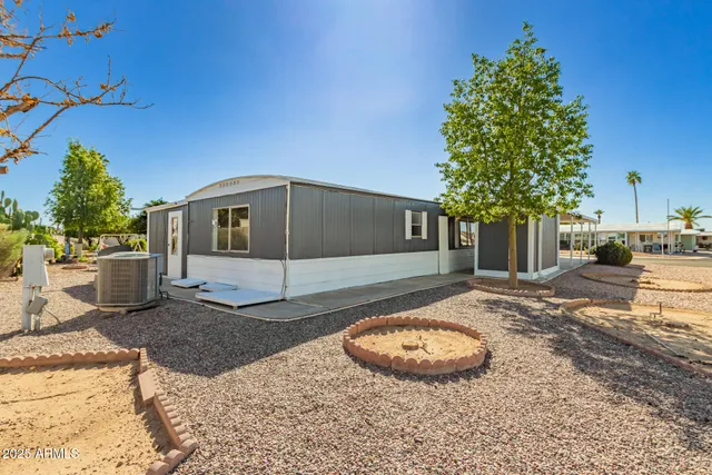a view of a house with a backyard